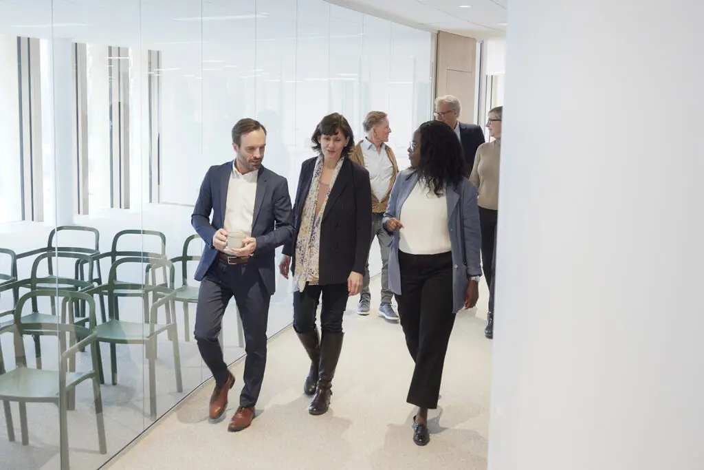 A picture of a fundraiser giving donors a private tour of a new building to reinvigorate a stalled fundraising campaign.